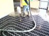  Screed being poured over underfloor heating pipes - 